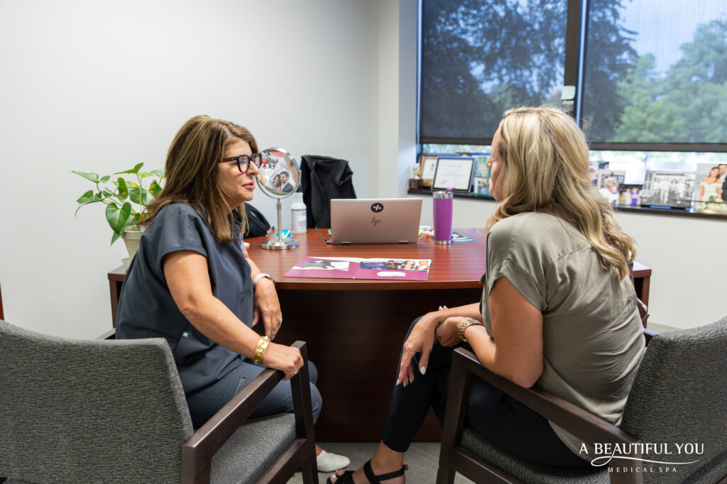 A patient and provider at A Beautiful You discussing hyperpigmentation treatment near Germantown, TN