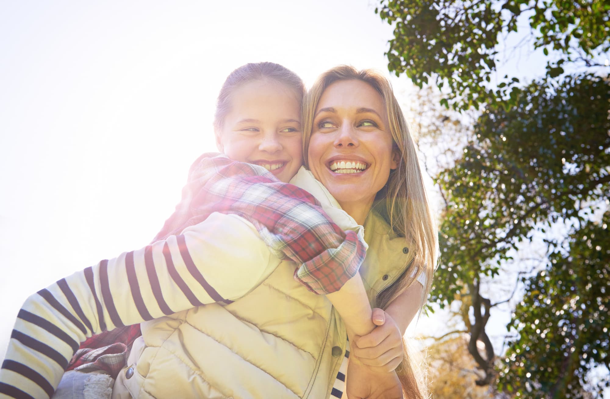 Mom is able to play with her child again because of Emsella