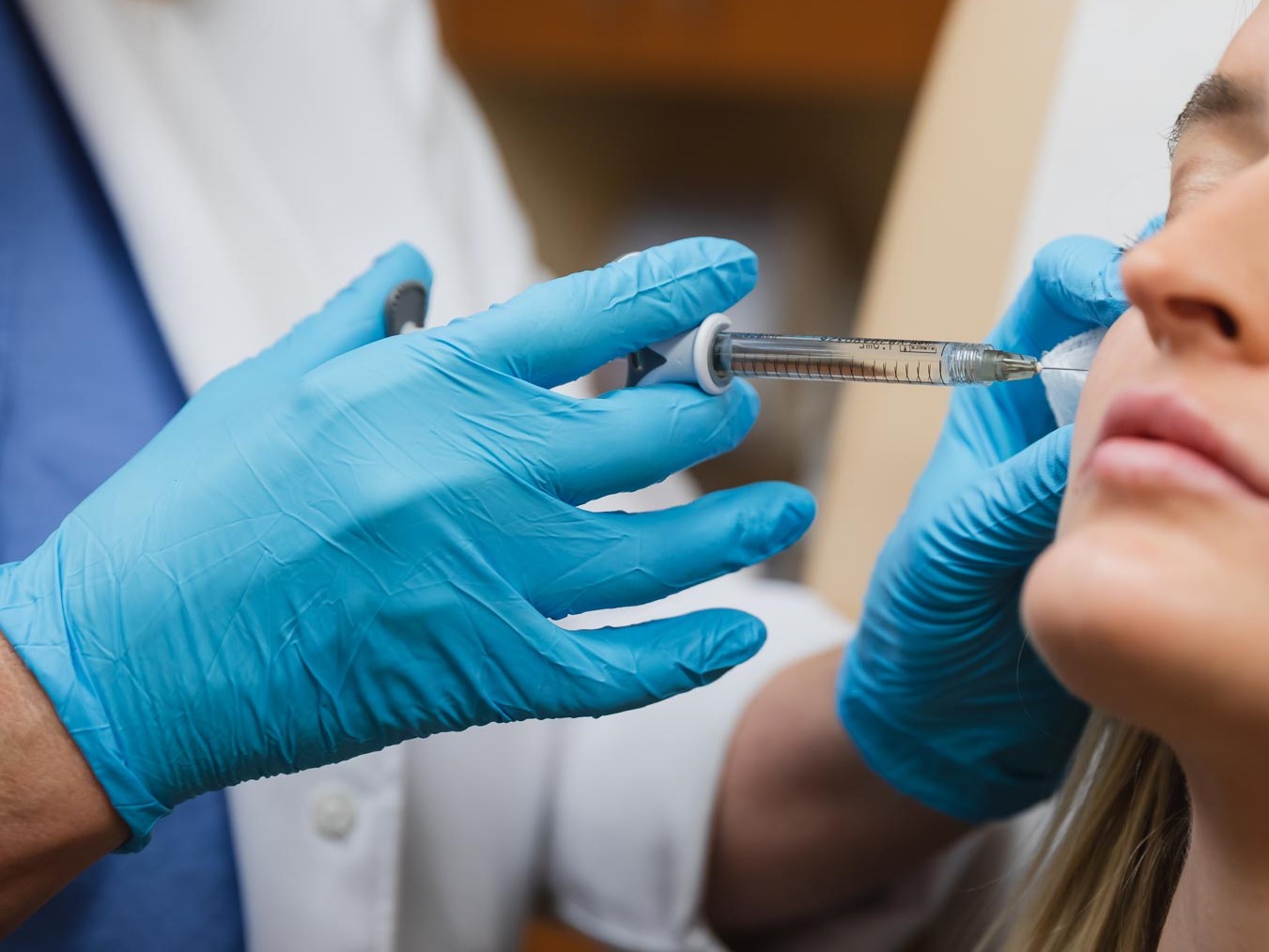 Close up of a woman getting dermal filler in her cheeks